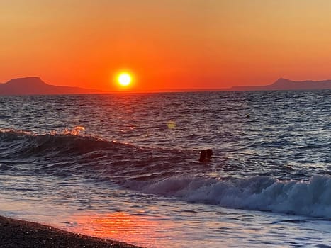 summer sunset on the sea coast in Creta, Greece, at 02 August 2023. Beautiful sunset by the sea in a beach on Kreta. Fantastic sunset on the Mediterranean Crete. High quality photo