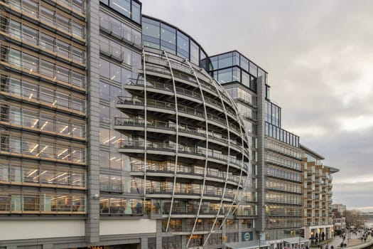 London, UK - Feb 27, 2024 - Modern architectural design of Riverside House. Exterior detail of Curved building along the River Thames of the City of London. Space for text, Selective focus.