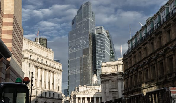 London, UK - Feb 27, 2024 - View of Bank of England, Royal Exchange with skyscrapers in background of the City of London. Space for text, Selective focus.