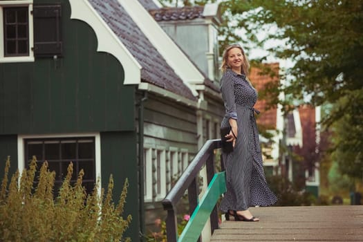 Beautiful woman in a dress in the evening Zaanstad, Netherlands.