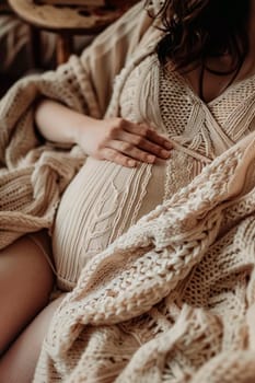 pregnant woman sitting on the sofa. Selective focus. people.