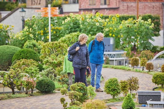 The Hague, Netherlands, August 30, 2023: Tourists in miniature city in Madurodam park