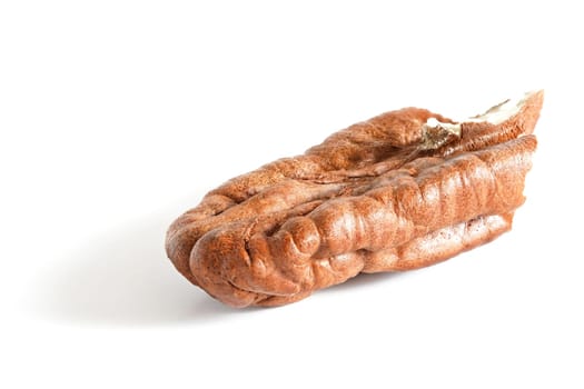 Opened pecan nut kernel without shell isolated on white background, closeup detail