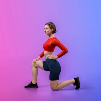 Full body length gaiety shot athletic and sporty young woman in fitness exercise posture on isolated background. Healthy active and body care lifestyle.