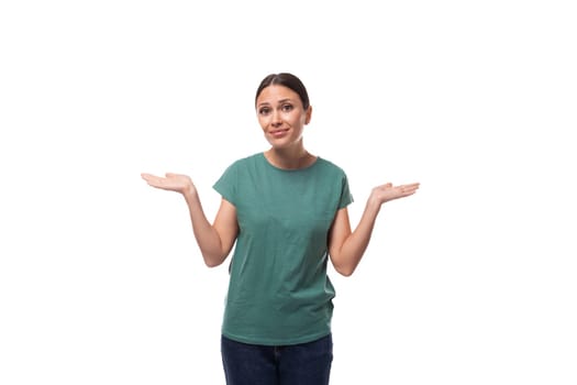 30 year old slender European brunette woman with ponytail hairstyle dressed in green t-shirt has doubts.