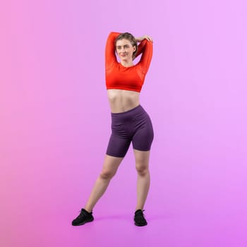 Full body length gaiety shot athletic and sporty young woman with fitness warmup and stretching body for pre exercise posture on isolated background. Healthy active and body care lifestyle.