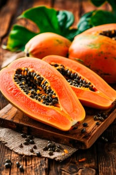 Papaya on a wooden background. Selective focus. Food.