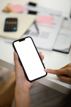 Close up of woman touching blank empty screen of mobile phone with finger.