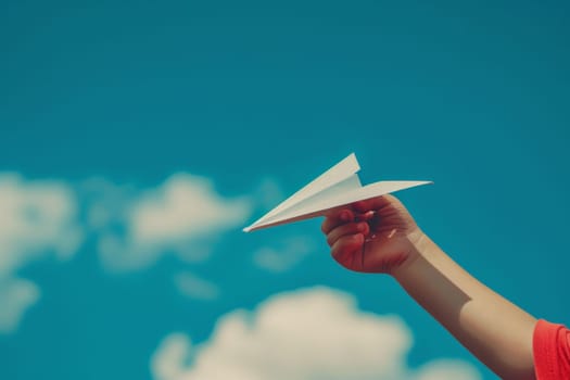 hand holding paper airplane in the sky, Taking flight, Dreams and imagination, concept of freedom.