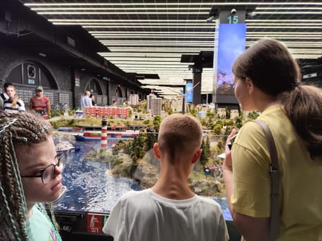 Saint-Petersburg, Russia - August 03, 2023: grand project Russia. Layout of city, country, street, landscape with small toy people, houses, roads, cars, nature and visitors tourists in the museum