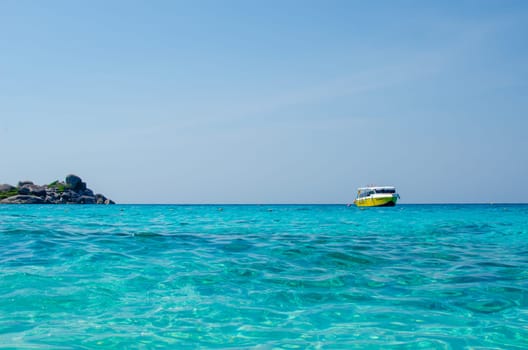 Tropical islands of ocean blue sea water and white sand beach at Similan Islands with famous Sail Rock, Phang Nga Thailand nature landscape. High quality photo