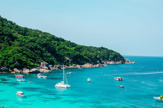 Tropical islands of ocean blue sea water and white sand beach at Similan Islands with famous Sail Rock, Phang Nga Thailand nature landscape. High quality photo