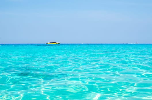 Tropical islands of ocean blue sea water and white sand beach at Similan Islands with famous Sail Rock, Phang Nga Thailand nature landscape. High quality photo