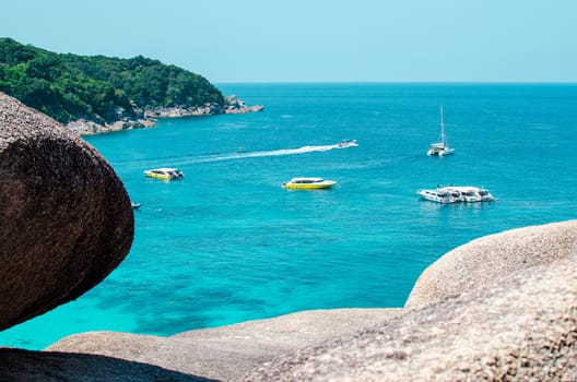 Tropical islands of ocean blue sea water and white sand beach at Similan Islands with famous Sail Rock, Phang Nga Thailand nature landscape. High quality photo