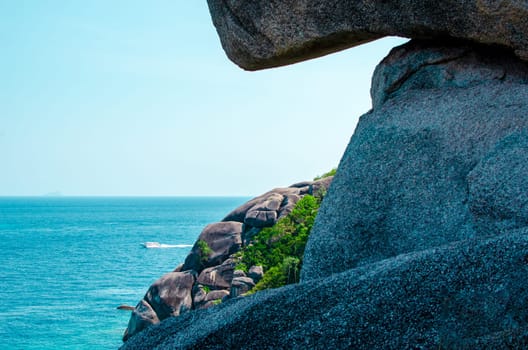 Tropical islands of ocean blue sea water and white sand beach at Similan Islands with famous Sail Rock, Phang Nga Thailand nature landscape. High quality photo