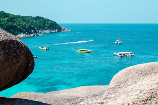 Tropical islands of ocean blue sea water and white sand beach at Similan Islands with famous Sail Rock, Phang Nga Thailand nature landscape. High quality photo