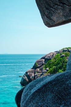 Tropical islands of ocean blue sea water and white sand beach at Similan Islands with famous Sail Rock, Phang Nga Thailand nature landscape. High quality photo