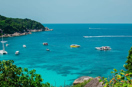 Tropical islands of ocean blue sea water and white sand beach at Similan Islands with famous Sail Rock, Phang Nga Thailand nature landscape. High quality photo