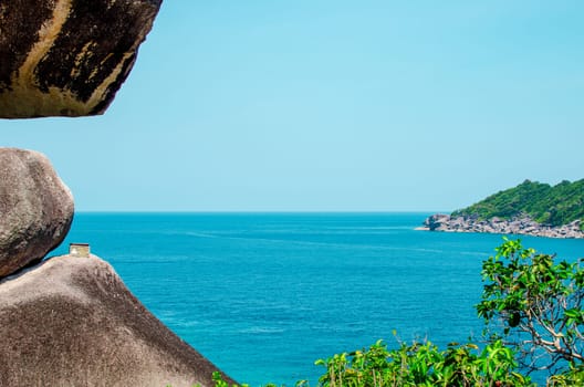 Tropical islands of ocean blue sea water and white sand beach at Similan Islands with famous Sail Rock, Phang Nga Thailand nature landscape. High quality photo