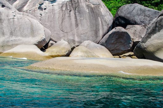 Rocks and stone beach Similan Islands with famous Sail Rock, Phang Nga Thailand nature landscape.