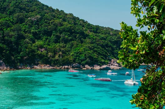 Tropical islands of ocean blue sea water and white sand beach at Similan Islands with famous Sail Rock, Phang Nga Thailand nature landscape. High quality photo