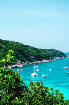 Tropical islands of ocean blue sea water and white sand beach at Similan Islands with famous Sail Rock, Phang Nga Thailand nature landscape. High quality photo