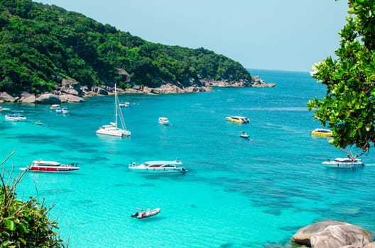 Tropical islands of ocean blue sea water and white sand beach at Similan Islands with famous Sail Rock, Phang Nga Thailand nature landscape. High quality photo