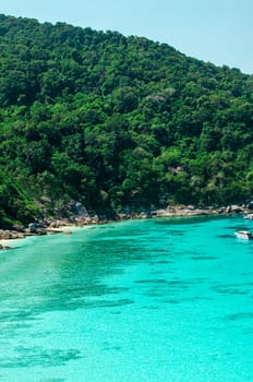 Tropical islands of ocean blue sea water and white sand beach at Similan Islands with famous Sail Rock, Phang Nga Thailand nature landscape. High quality photo