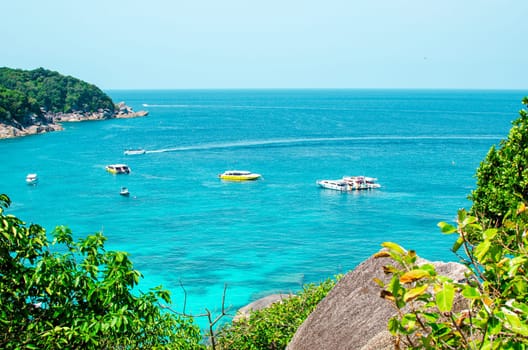 Tropical islands of ocean blue sea water and white sand beach at Similan Islands with famous Sail Rock, Phang Nga Thailand nature landscape. High quality photo