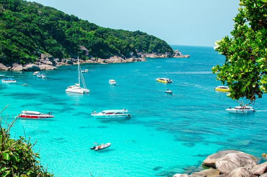 Tropical islands of ocean blue sea water and white sand beach at Similan Islands with famous Sail Rock, Phang Nga Thailand nature landscape. High quality photo