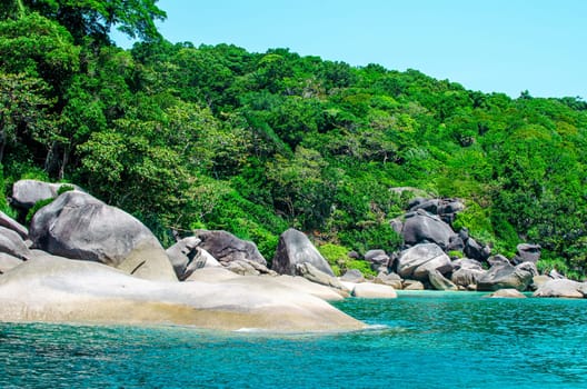 Tropical islands of ocean blue sea water and white sand beach at Similan Islands with famous Sail Rock, Phang Nga Thailand nature landscape. High quality photo