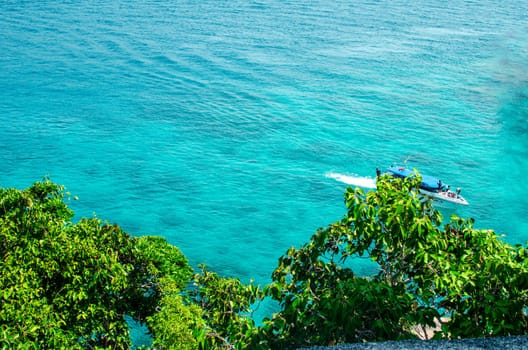 Tropical islands of ocean blue sea water and white sand beach at Similan Islands with famous Sail Rock, Phang Nga Thailand nature landscape. High quality photo