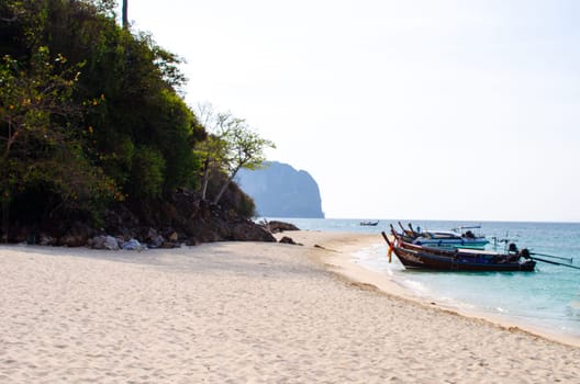 Views of the Islands of Thailand and turquoise water, rocks, yachts or boats.