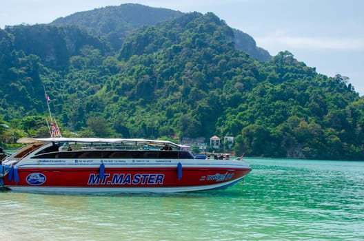 Views of the Islands of Thailand and turquoise water, rocks, yachts or boats.