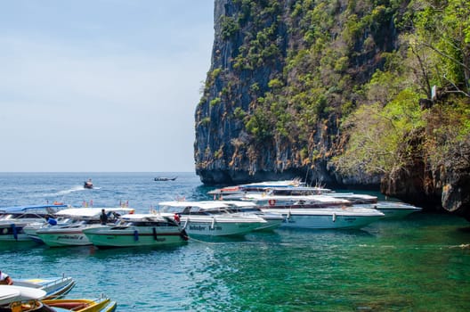 Views of the Islands of Thailand and turquoise water, rocks, yachts or boats.