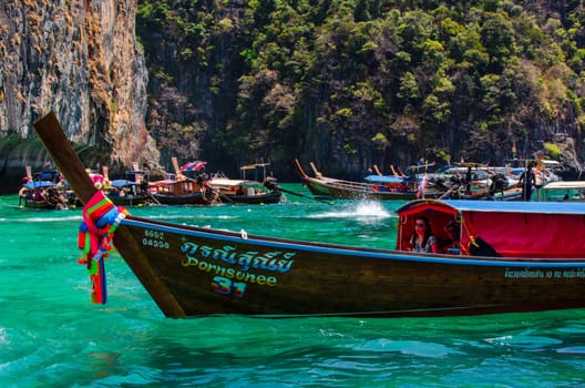 Views of the Islands of Thailand and turquoise water, rocks, yachts or boats.