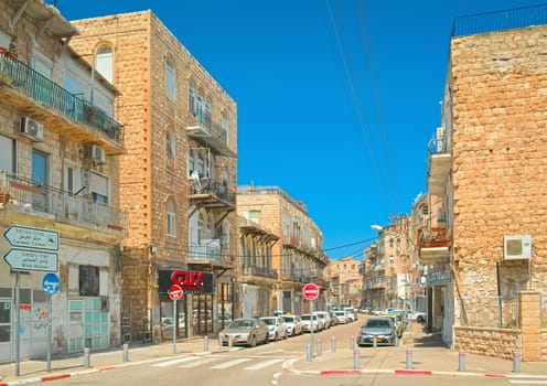 Haifa, Israel - 6 May, 2023: A typical street with historic residential buildings in Israel's third largest city.