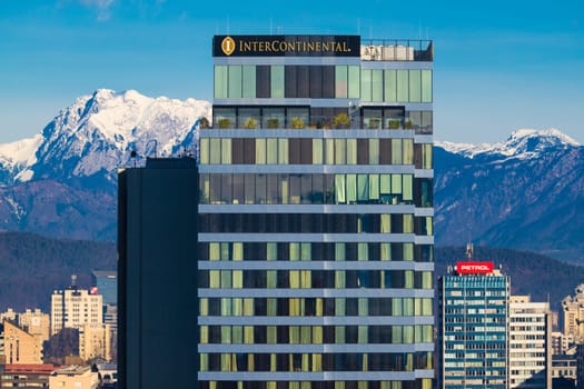 Ljubljana, Slovenia - December 23, 2023: The Intercontinental hotel building close up with the snowy Alps in the background