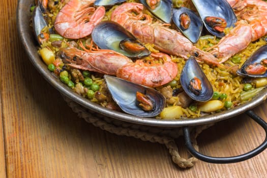 Seafood paella in a pan showcasing traditional Spanish flavors and ingredients, typical Spanish cuisine, Majorca, Balearic Islands, Spain,