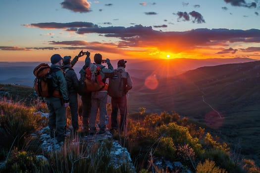 Hiking group at sunrise on a mountain. High quality photo