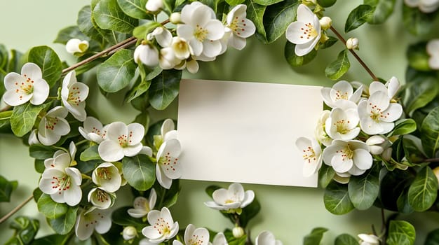 A blank white greeting card nestled among delicate white blossoms with lush green leaves, suggesting a scene of natural beauty perfect for a heartfelt message - Generative AI