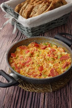 Turkish Menemen omelet in a frying pan.