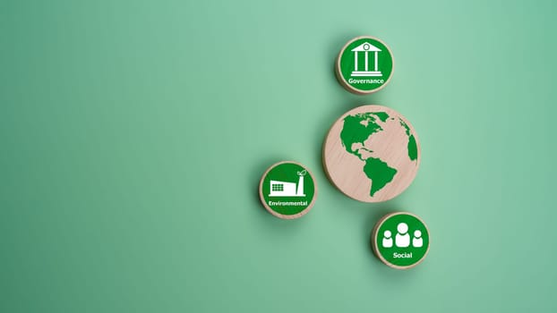 ESG concepts for sustainable environment, society and governance Businesses are environmentally responsible, A circular wooden board with the abbreviation ESG printed on a green background.