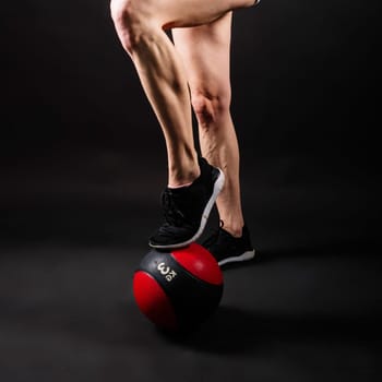 Strong woman does exercise with a med ball slams. Strength and motivation.