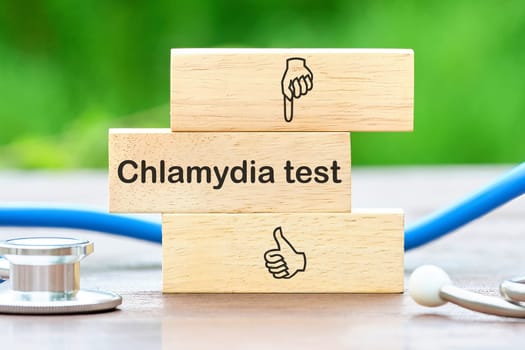 Medical concept. Chlamydia Test text on wooden blocks on a green background