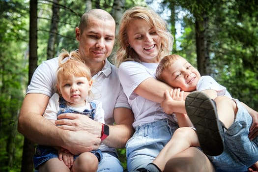 Family playing in the forest