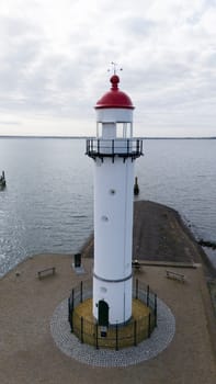 The lighthouse in Hellevoetsluisin the netherlands made with a drone aerial view