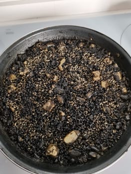 Arroz Negro Black Rice. Traditional Valencian Dish. The Black Rice is similar to the seafood paella, but cooked with squid ink.