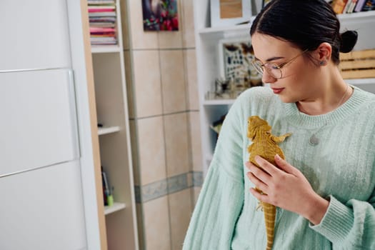 A beautiful woman in a joyful moment, posing with her adorable bearded dragon pets, radiating love and companionship.