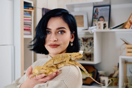 A beautiful woman in a joyful moment, posing with her two adorable bearded dragon pets, radiating love and companionship.